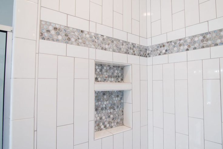White Tiled Shower with Gray Stone Hexagon Tile Accent Strip and .