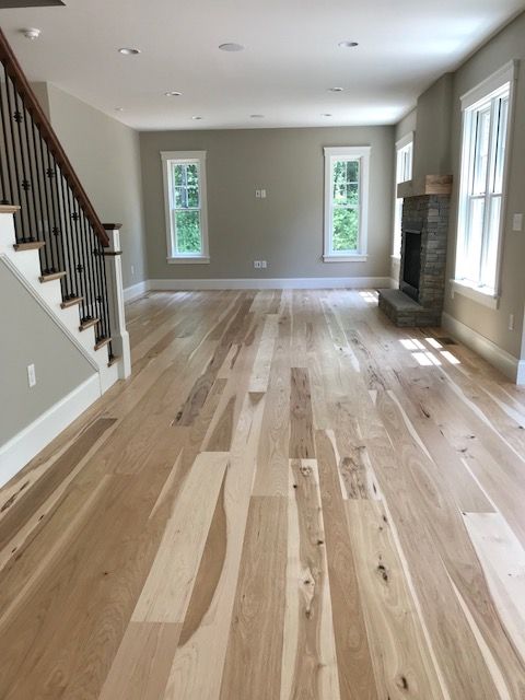 Character grade wide plank hickory flooring finished with a bona .