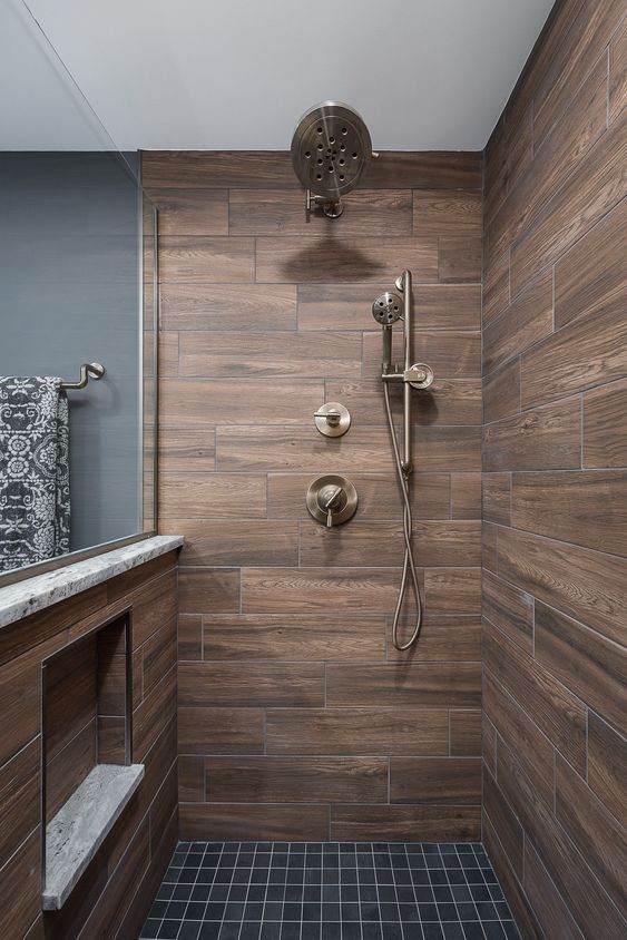 a stylish contemporary bathroom clad with wood look tiles and .
