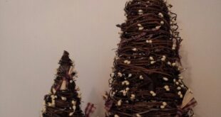 Grapevine trees decorated with pip garland and gingham/raffia .