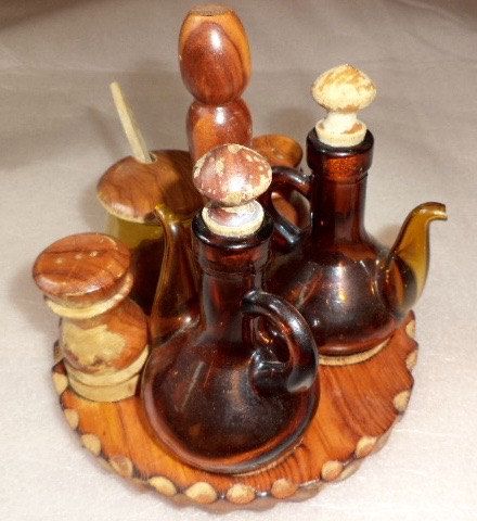 Antique 7pc Condiment Set Hand Carved Wood Amber Glass Cruets .