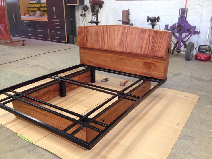 Custom made headboard and bed frame. Wood and steel furniture .
