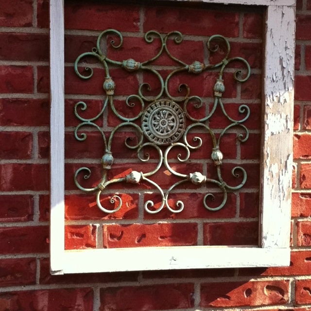 Old window frame from salvage and wrought iron decor from Hobby .