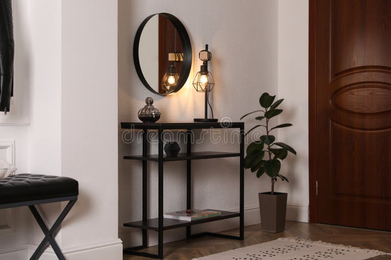 Console Table with Decor and Mirror on Wall in Hallway. Interior .