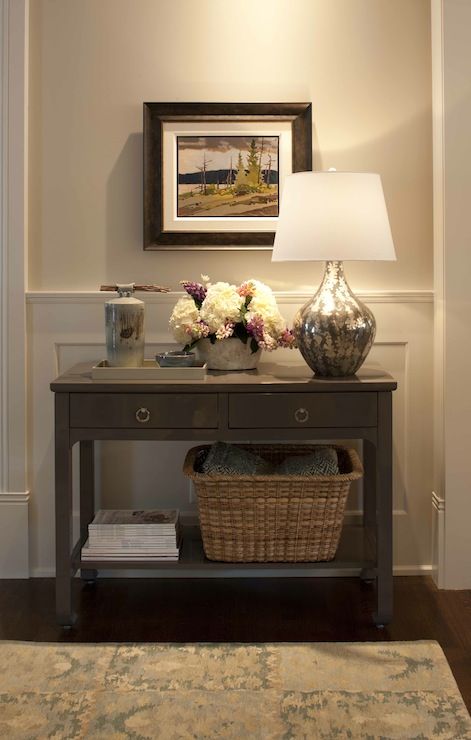 Traditional foyer with light gray walls paint color paired with .