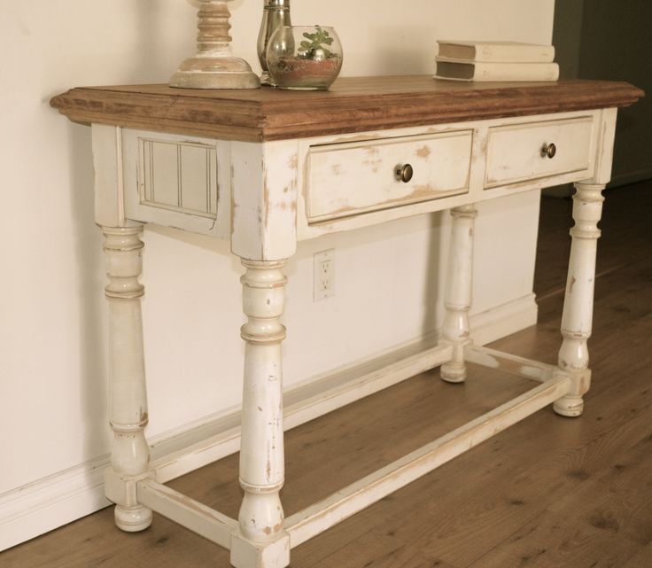 Farmhouse style console table. Distressed white paint, light stain .