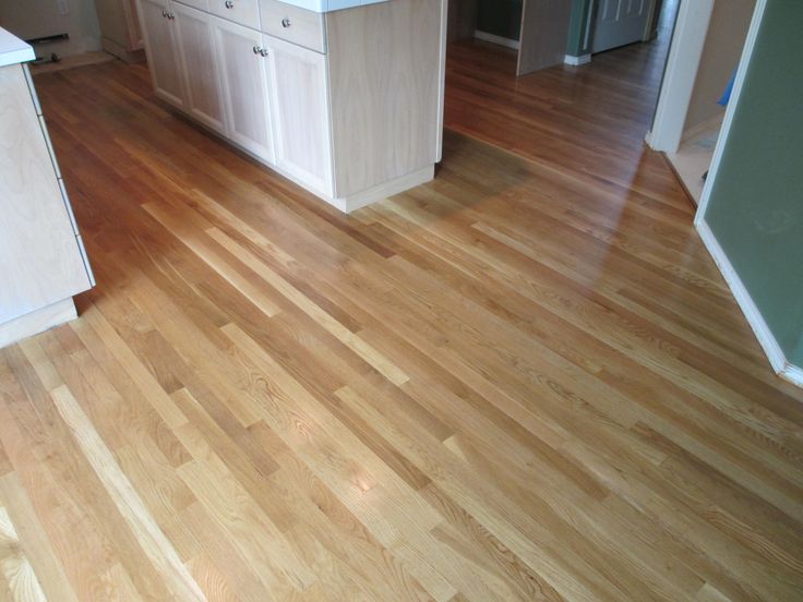 White oak floor, sand and finished by Domino Hardwood Floors, Inc .