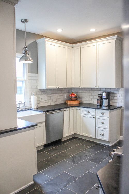 Modern Farmhouse Kitchen. Gray tile floors, white cabinets. Would .