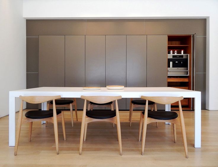 The bulthaup c2 table. Elbow Chairs originally designed by Hans J .