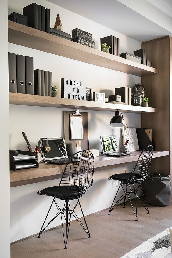 floating shelves in a niche and a floating desk top with the same .