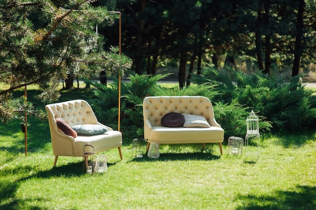 Premium Photo | Cozy wicker sofas for relaxing in the garden near .