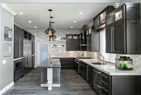 Grey plank tile, dark cabinets, light countertops for kitchen .
