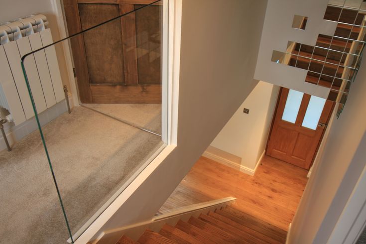 Frameless Interior Glass Balustrade with invisible fixing points .