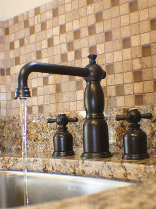 Another oil rubbed bronze faucet w/ undermount stainless steel .