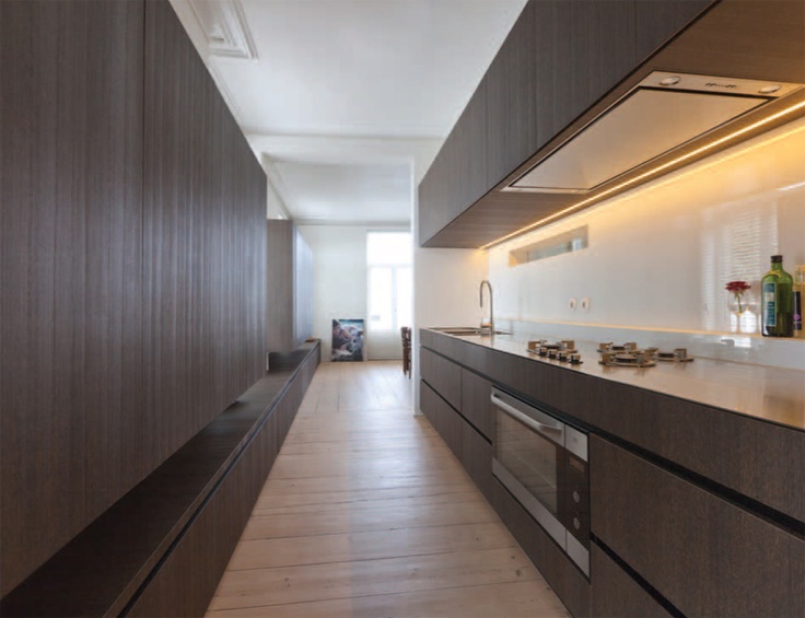 Long kitchen with extra long bench by Belgian architect Pieter .