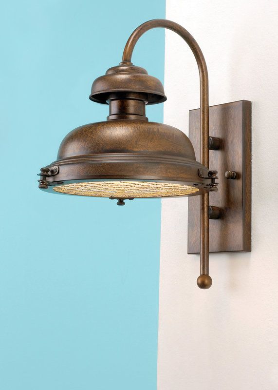 Tall Outdoor Wall Sconce from the Escotilha Collection .