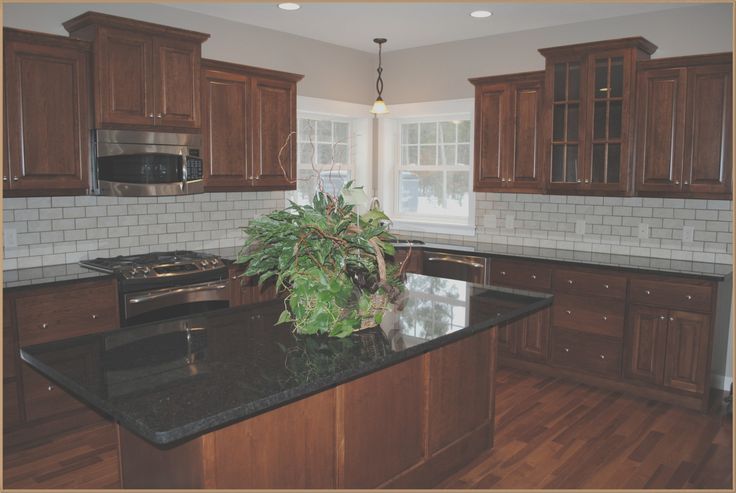 Cherry Cabinets with Black Granite Countertops in 2023 | Brown .