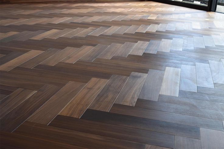 This Select Grade Herringbone parquet walnut floor has an oiled .