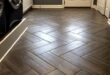 Mudroom flooring. Gray, wood grain tile in herringbone pattern. {a .