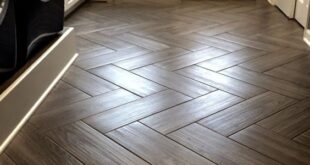 Mudroom flooring. Gray, wood grain tile in herringbone pattern. {a .