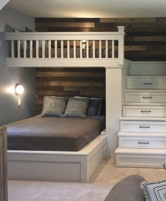 LOVE the shiplap rustic wall and the bunk storage in the stairs .