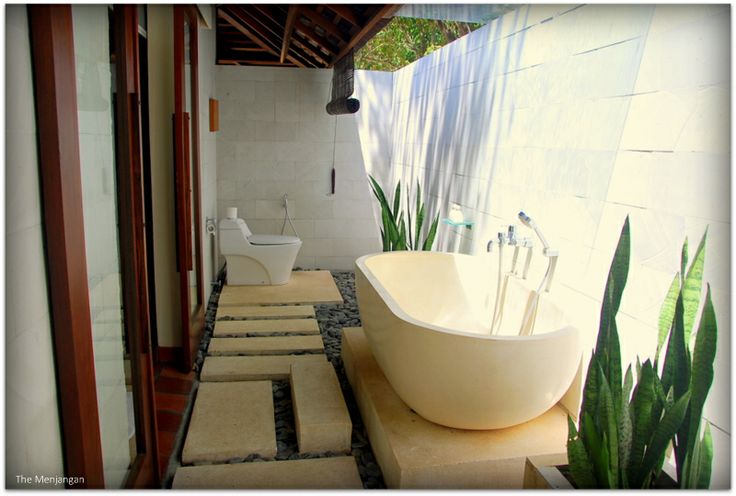 Each villa features an outdoor bathroom area, an exclusive .