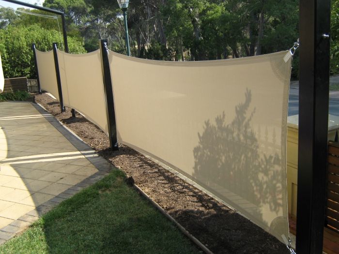 Vertical shade sails, a option for privacy fence? If ever needed .