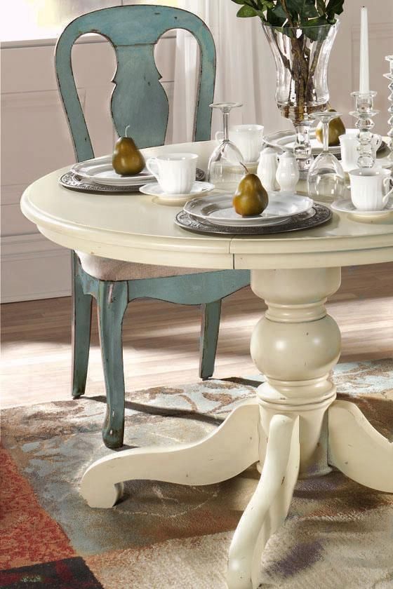 Blue antique-style dining table and chairs from Home Decorators .