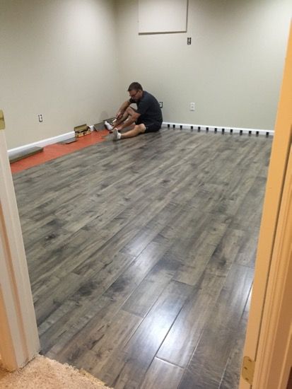 Our first DIY project - laminate flooring in Ben's basement office .