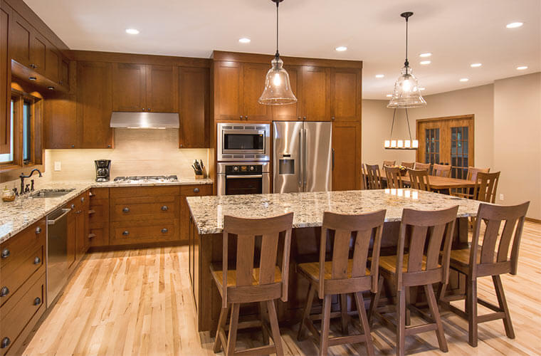 Spacious Kitchen and Dining Area with Solid Cherry Wood Table .