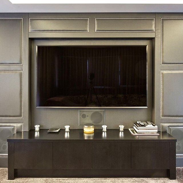 Stud work upholstery on this amazing TV unit. Combination of wood .