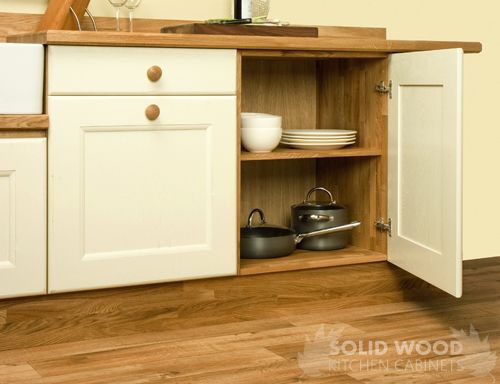 Solid Oak kitchen base cabinets, including solid wood belfast sink .