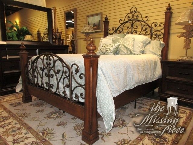 Dark wood bed with iron scroll details in a queen size. Such an .