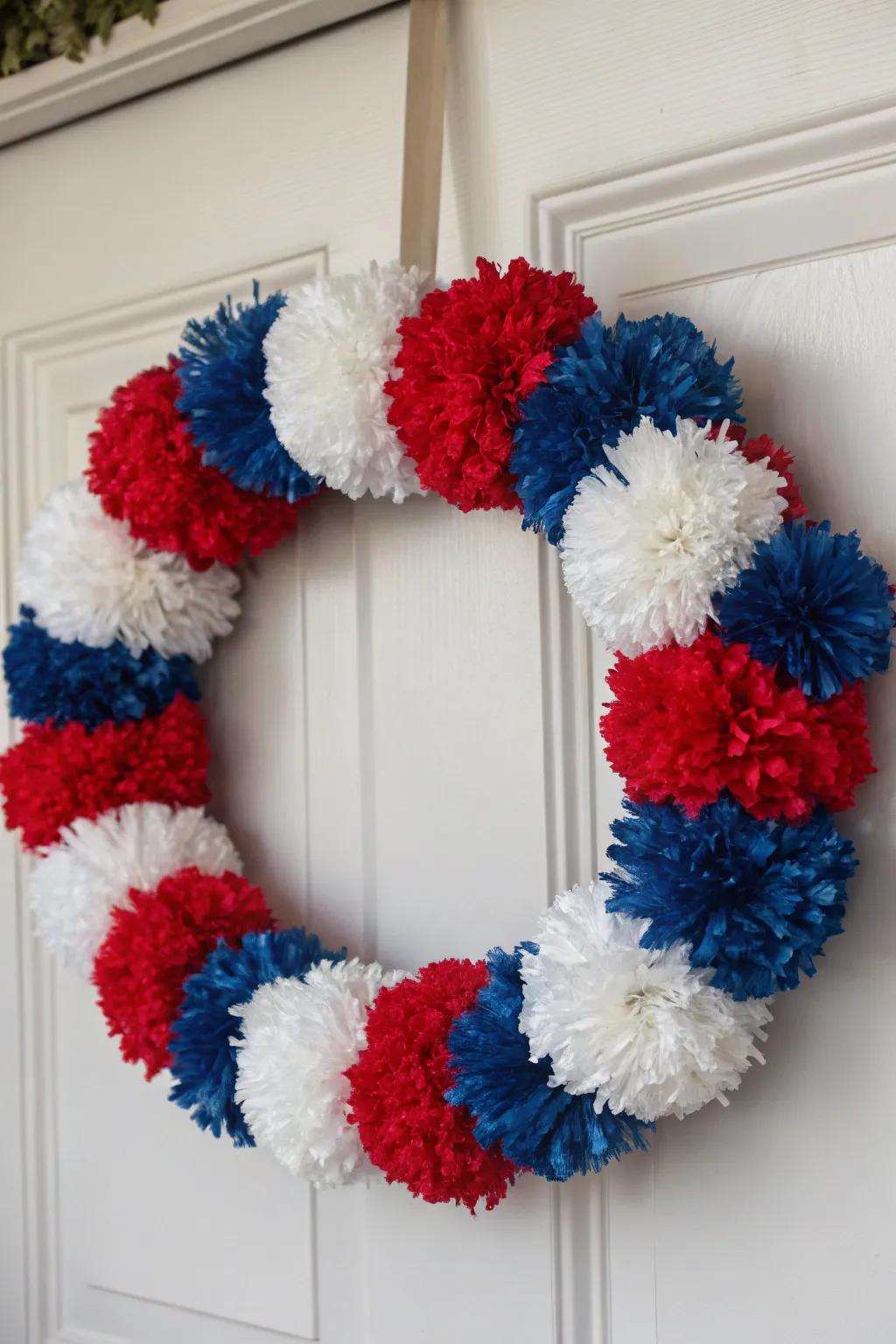 A cheerful and playful wreath adorned with colorful pom-poms.