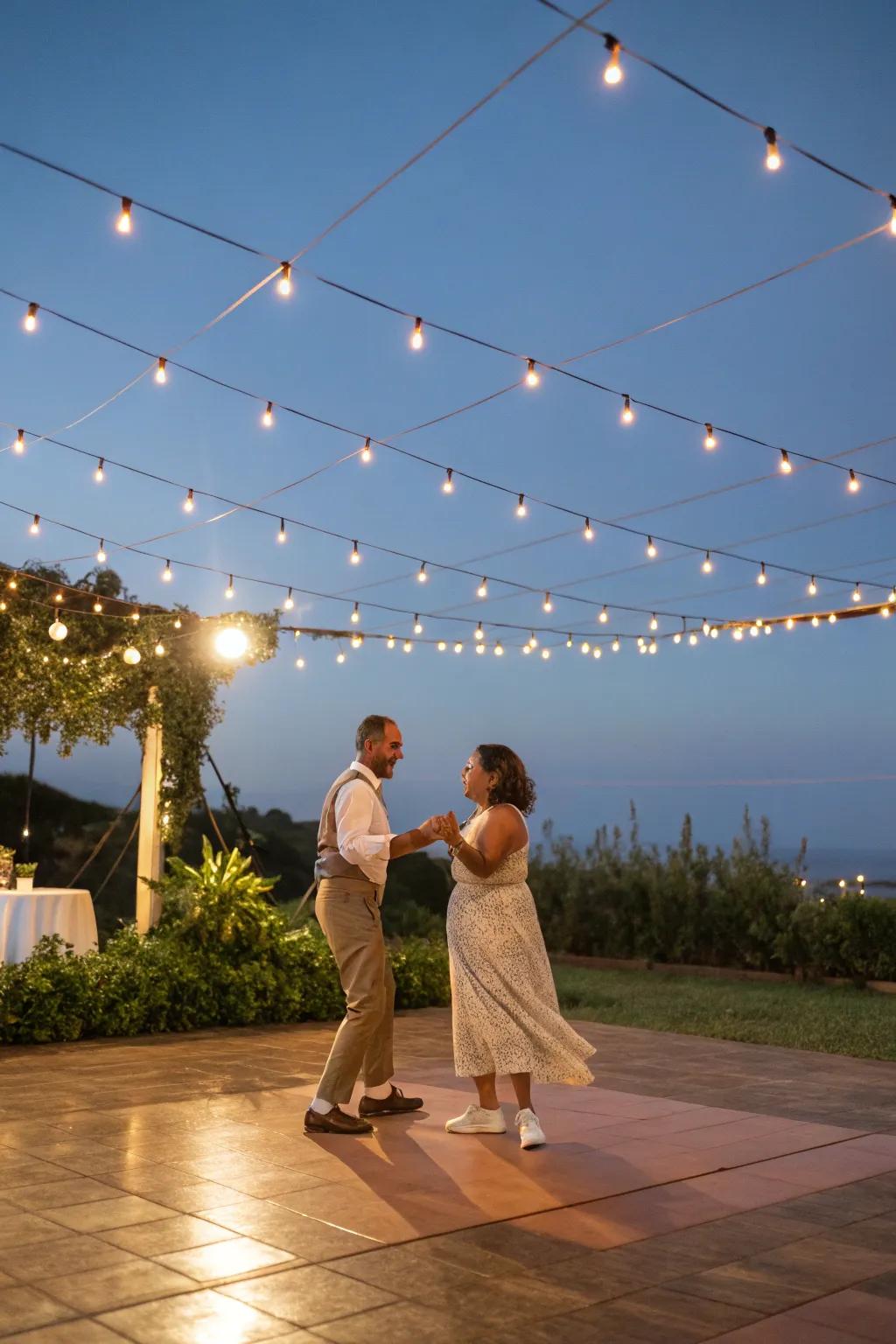 Guests enjoying an open-air dance floor under the starry sky.
