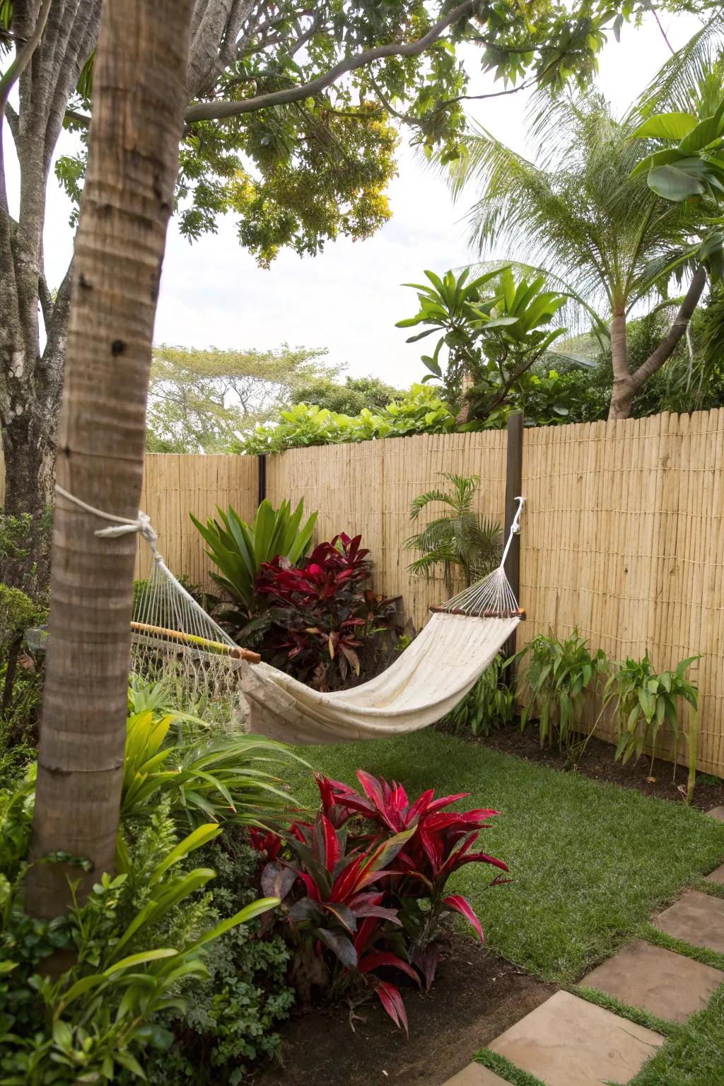 Reed fencing helps create a lush tropical retreat.