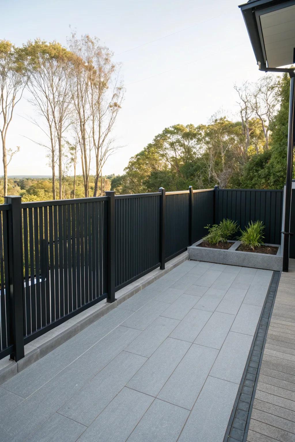 Modern black privacy elements define the patio space elegantly.