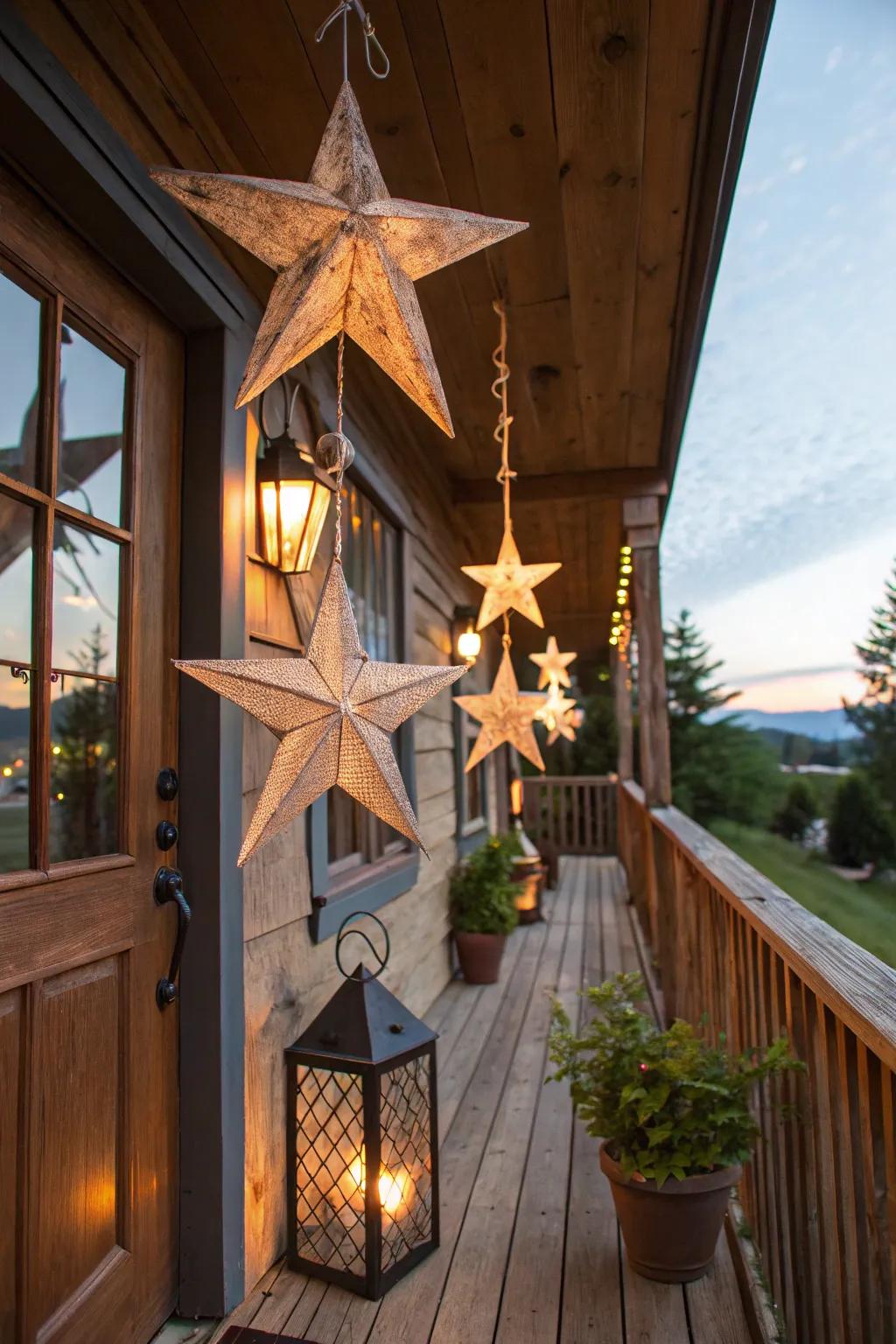 Stars made from reclaimed wood hanging as decorations on a rustic porch.
