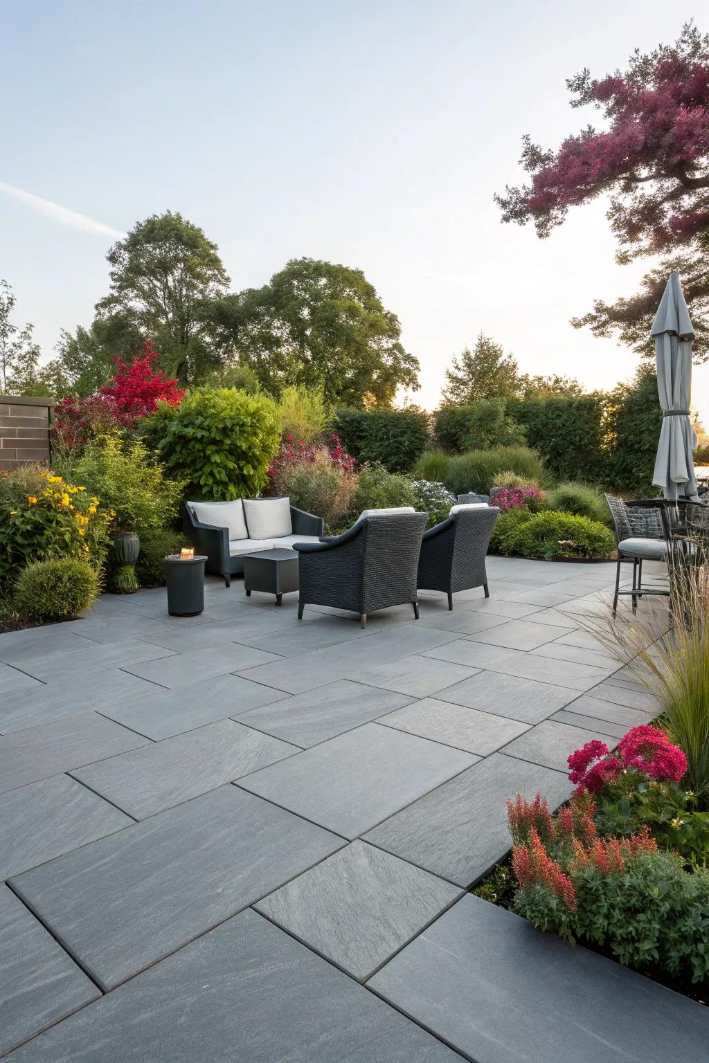 Grey tiles offer a sleek and versatile backdrop for outdoor decor.