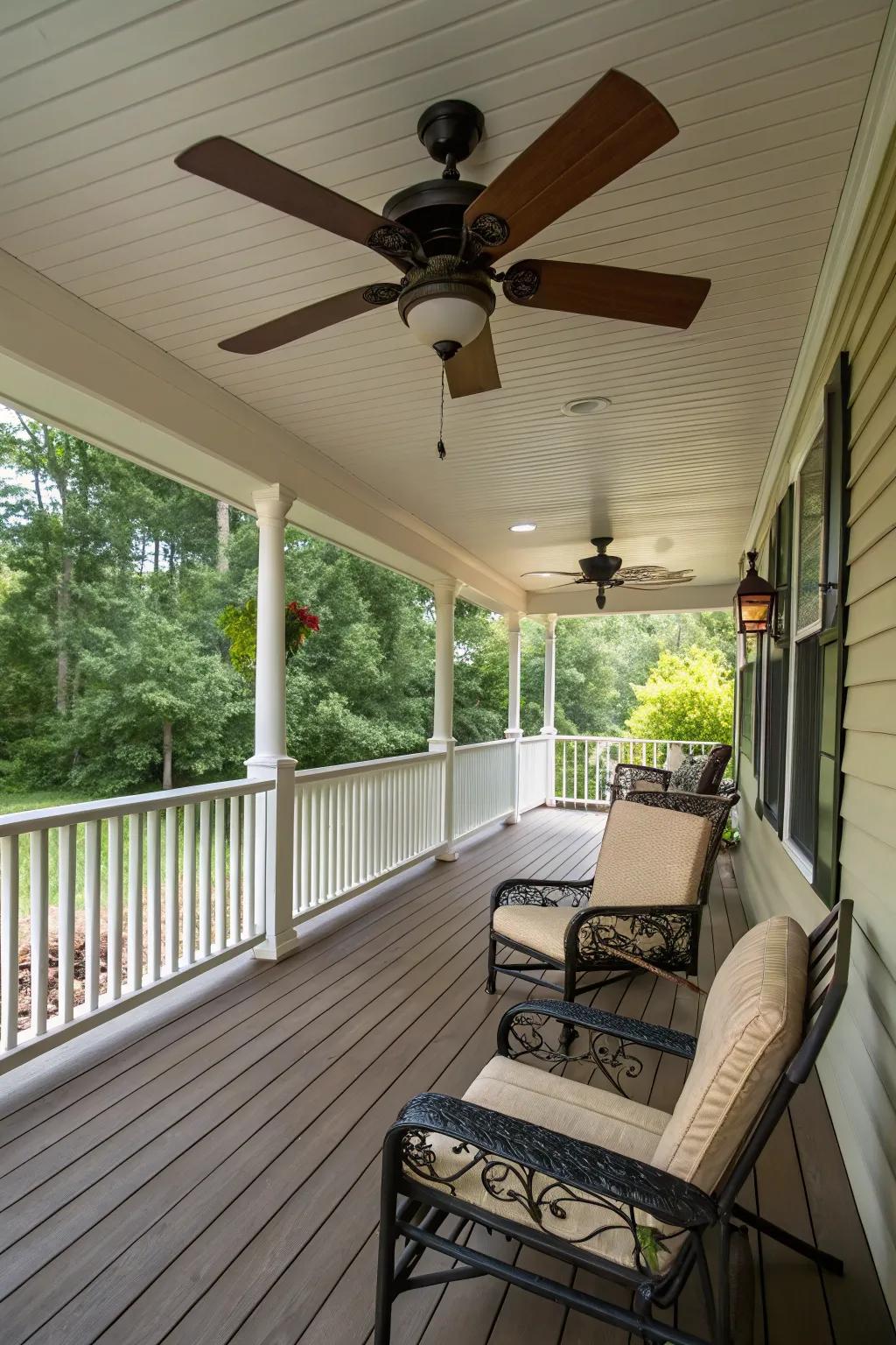 A ceiling fan provides a cool breeze on a sunny porch.