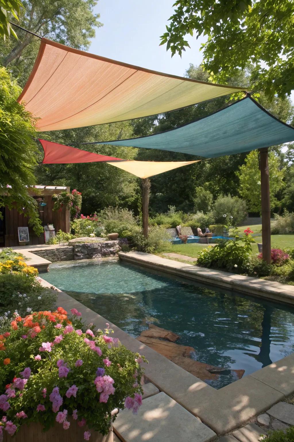 A dipping pool shaded by a vibrant shade sail.