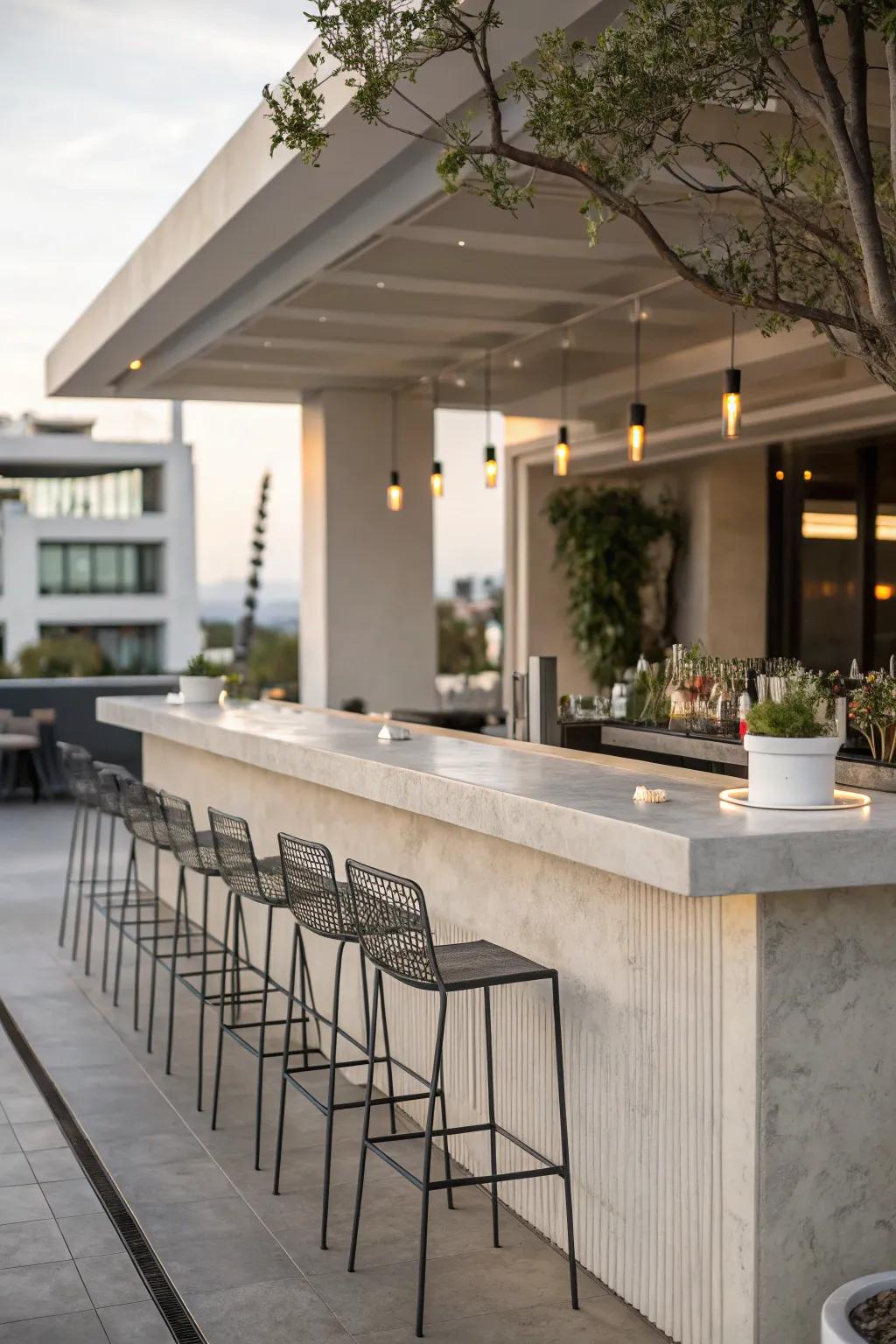 Concrete bar tops offer a sleek, modern aesthetic that's perfect for contemporary outdoor spaces.