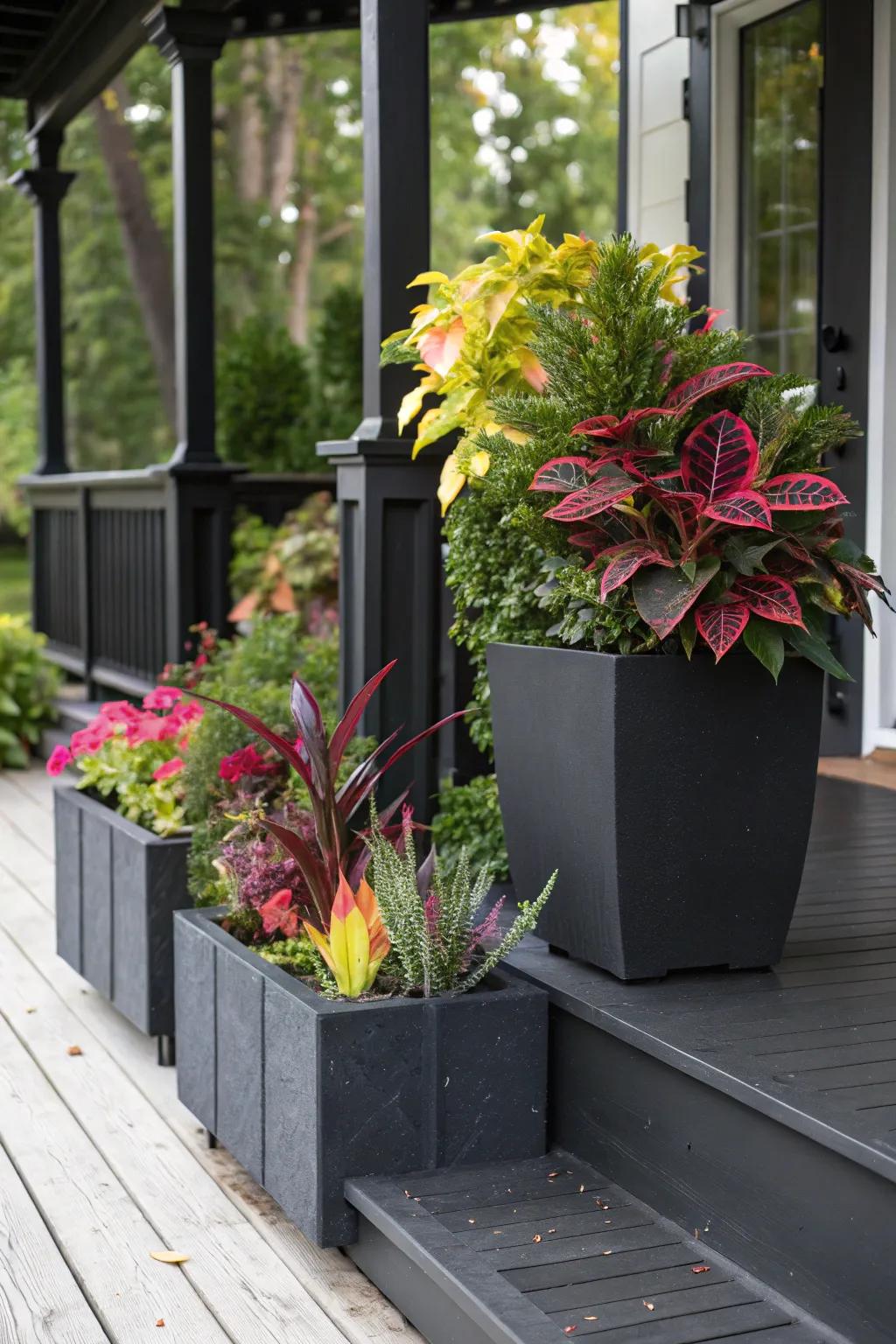Sleek black planters enhance the porch's modern aesthetic.