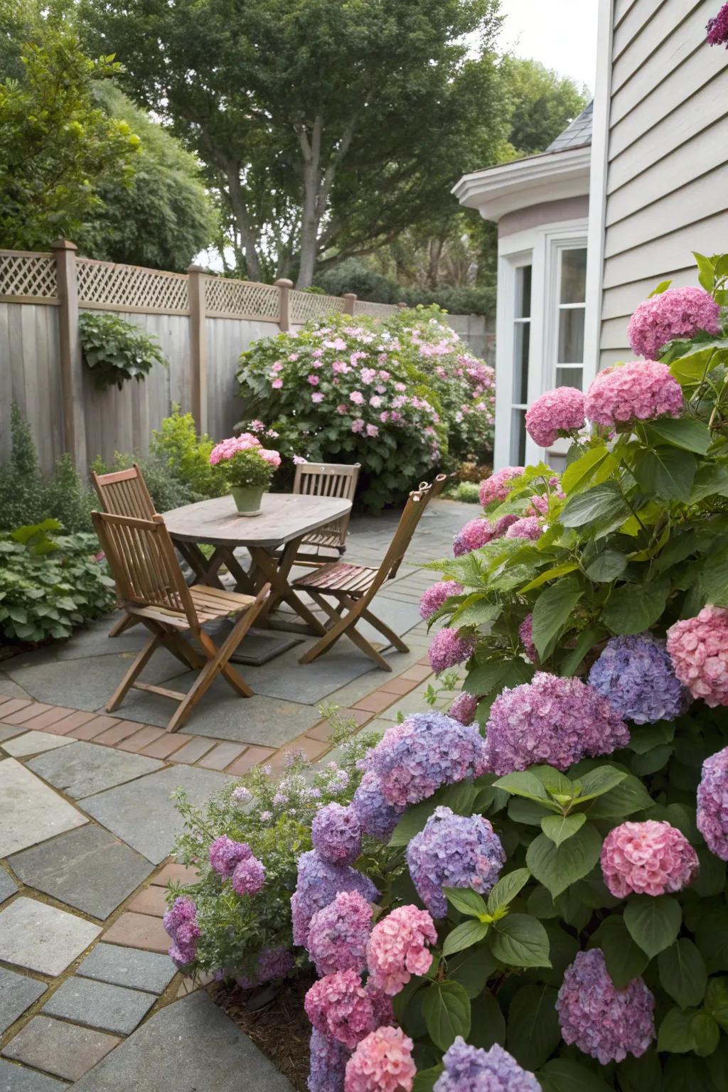 Hydrangeas around the patio create a vibrant outdoor retreat.