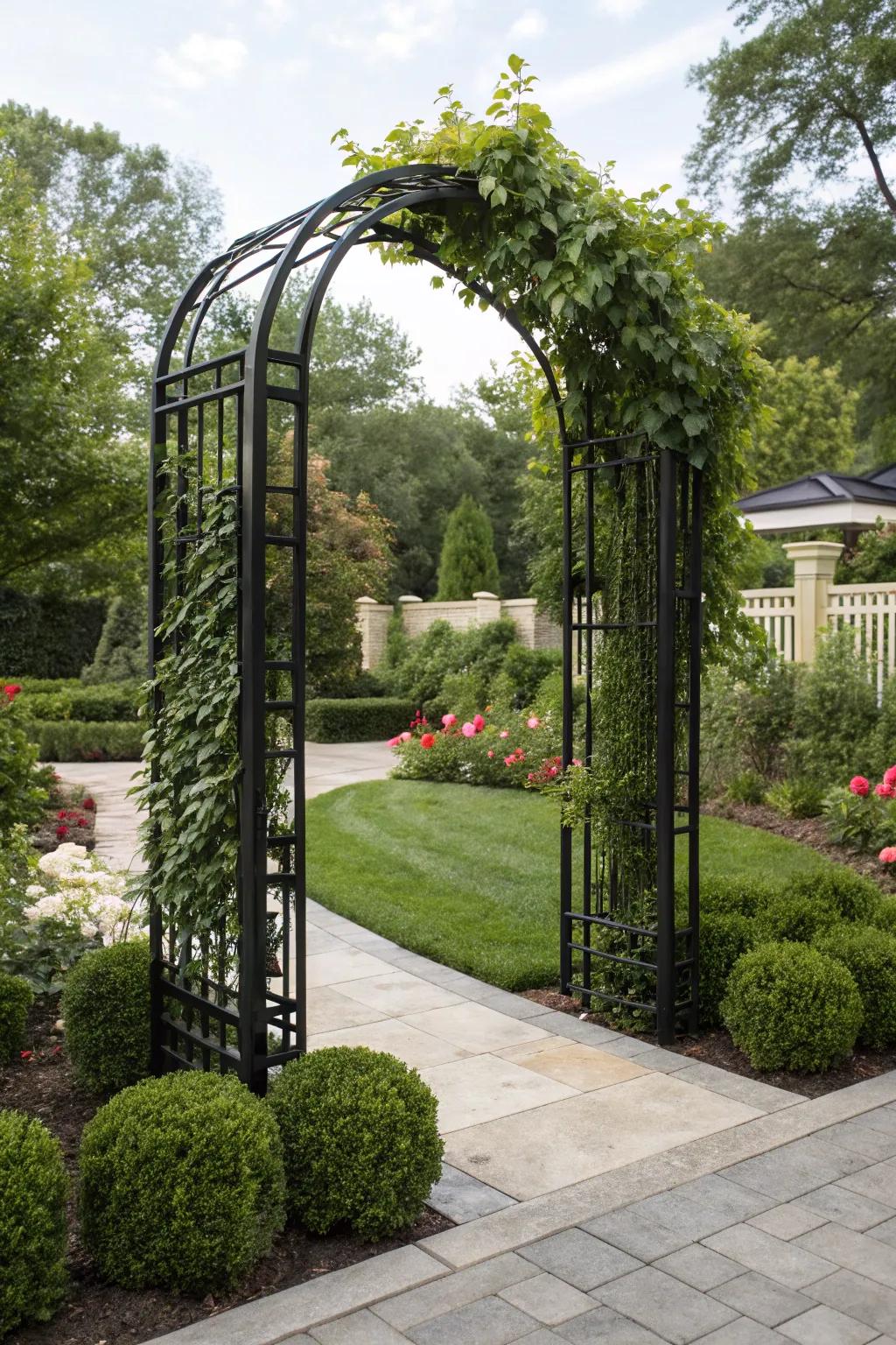 A modern metal arbor provides a striking contrast to lush greenery.