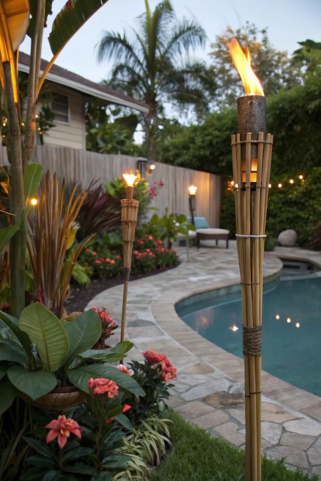 A backyard paradise with tiki decorations and colorful tropical flowers.