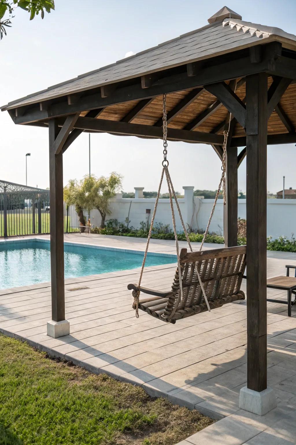 A playful gazebo with a swing offers a fun poolside retreat.