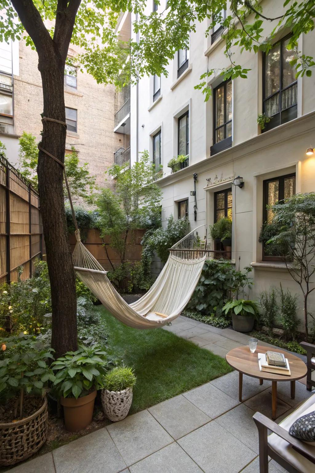 A peaceful relaxation nook in an apartment backyard, complete with a hammock.