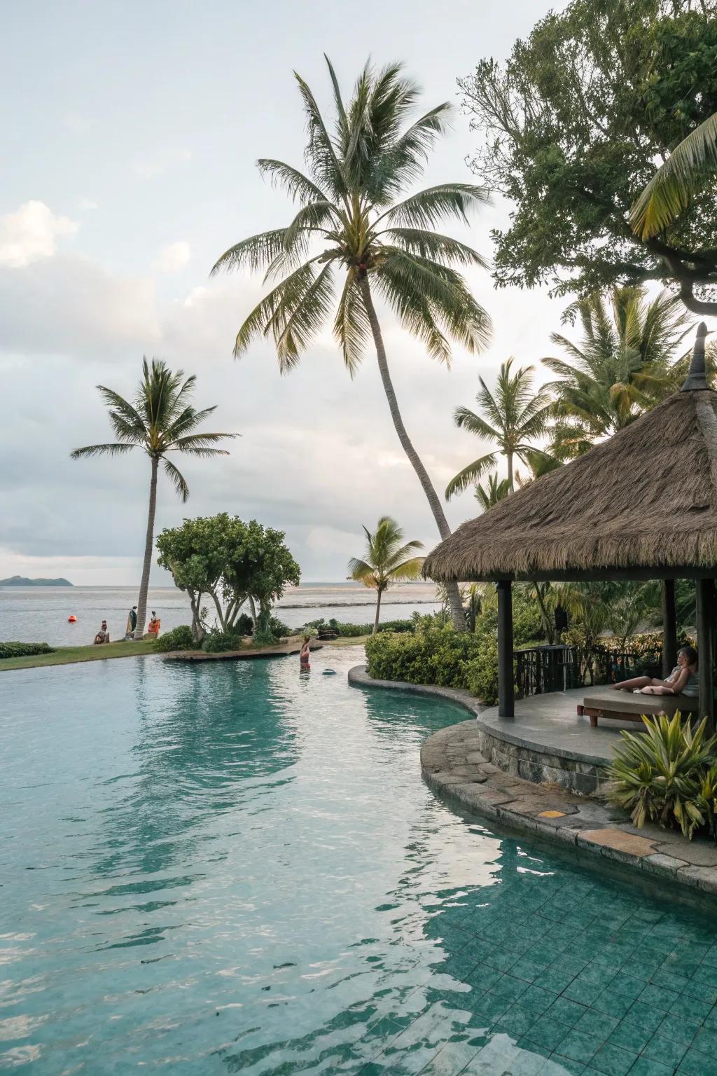 A tropical pool with a thatch shade structure.