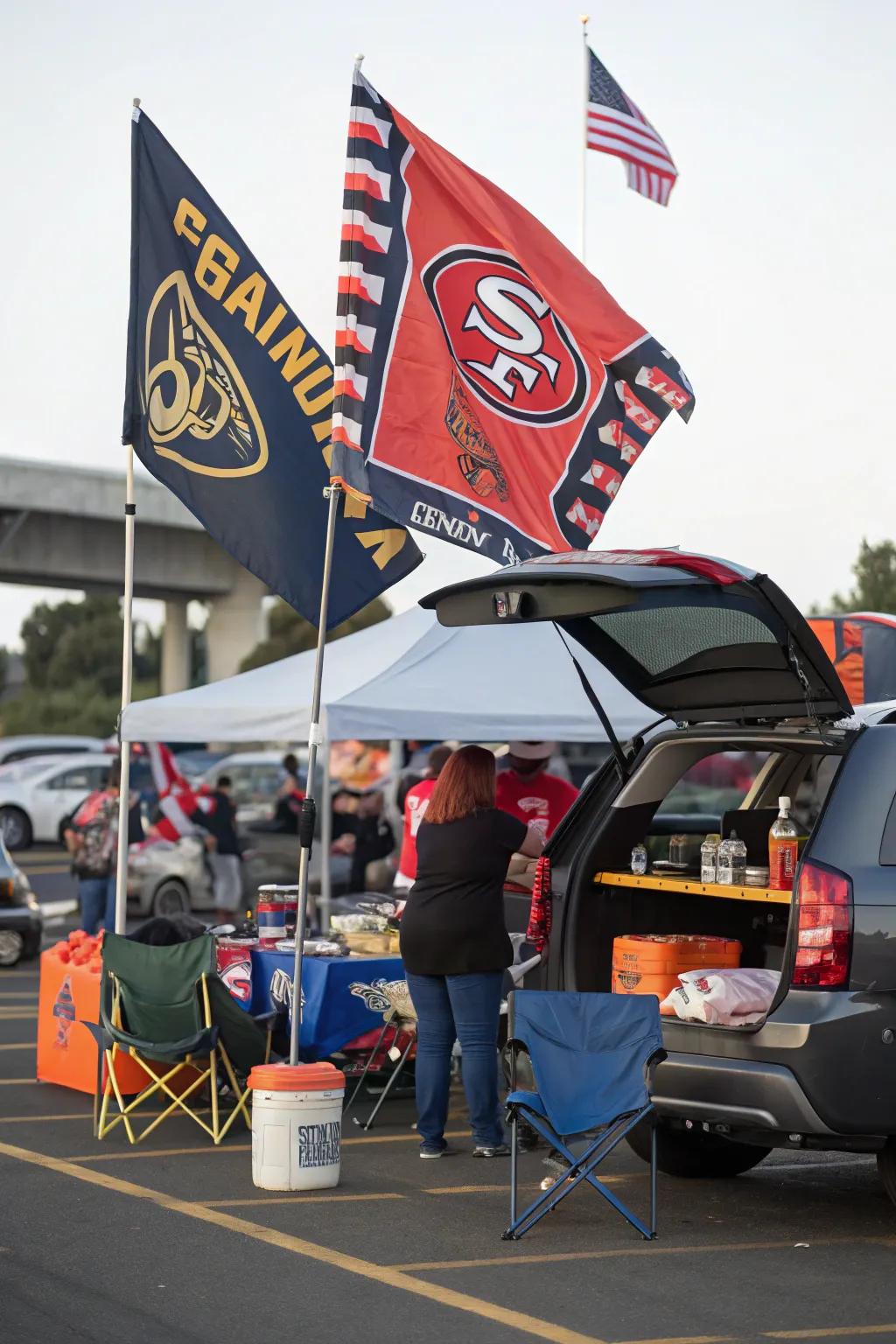 Tailgate setup with team-themed banners and flags.